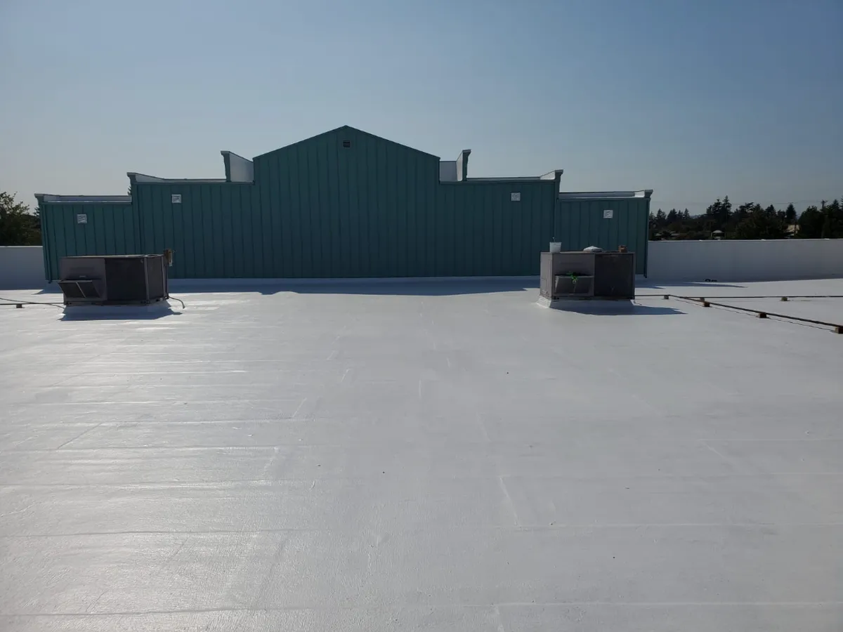 Commercial flat roof with HVAC units after a TPO installation