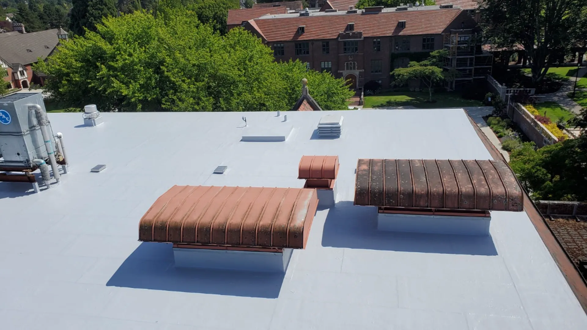 Commercial building with a new white TPO roof