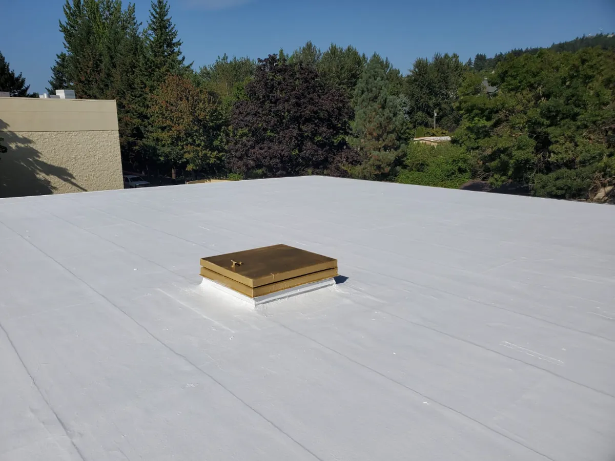Flat TPO roof with a sealed skylight curb