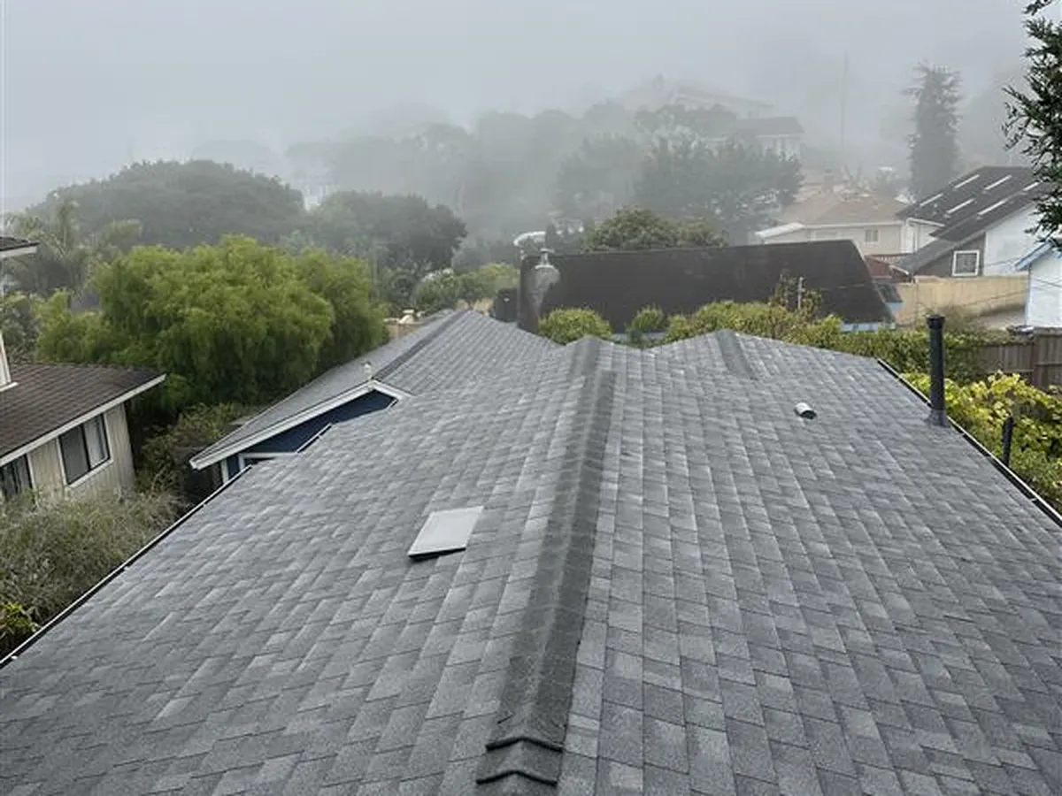 Ridge line and shingles of a Bay Area home during a roof inspection