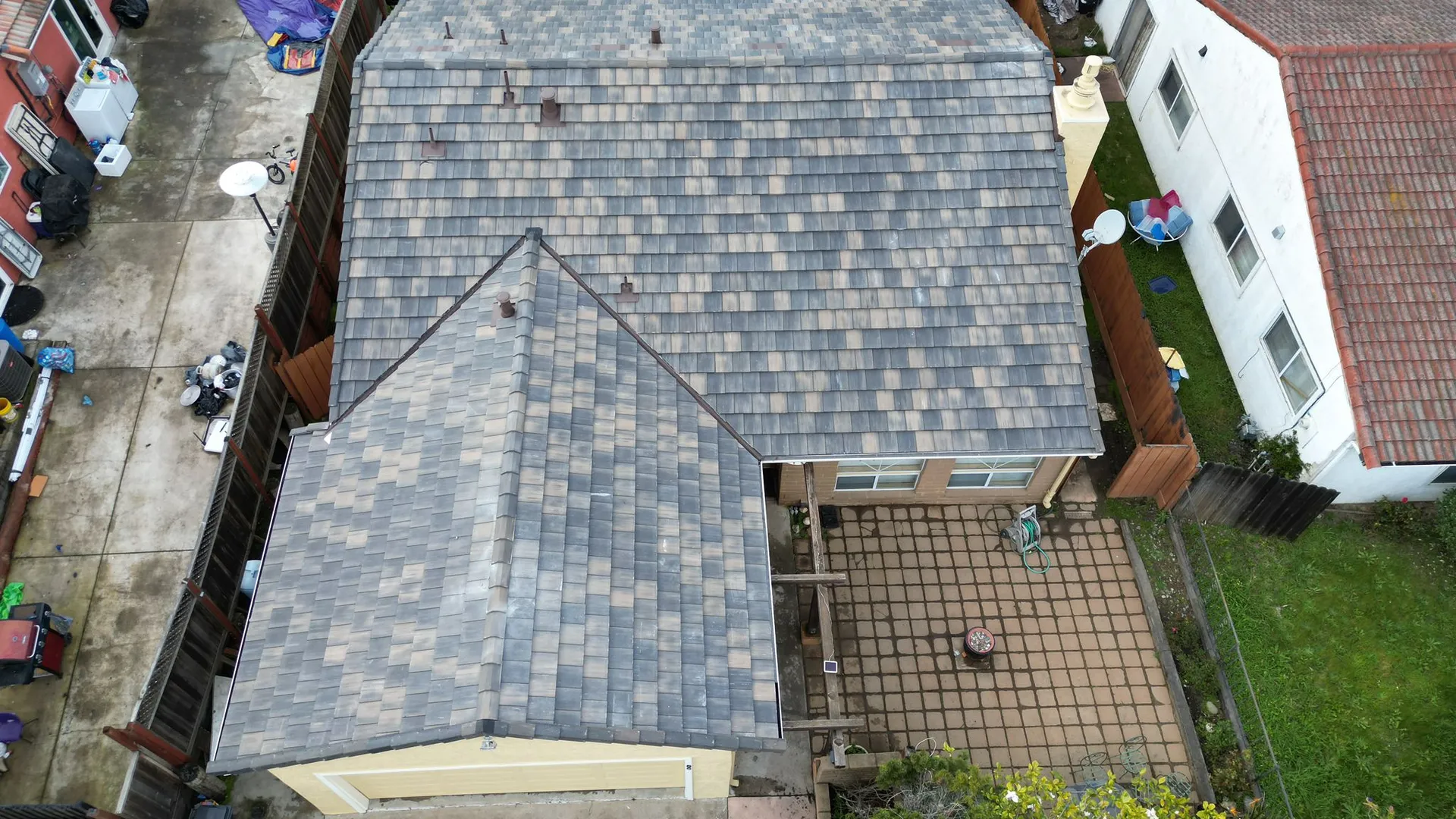 Aerial view of a new asphalt shingle roof installed by Premier Roofing