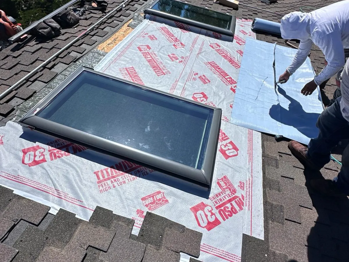 Skylight installation with new flashing and underlayment